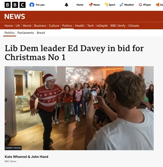 BBC News: Lib Dem leader Ed Davey in bid for Christmas No 1, with a photo of Will filming the choir.