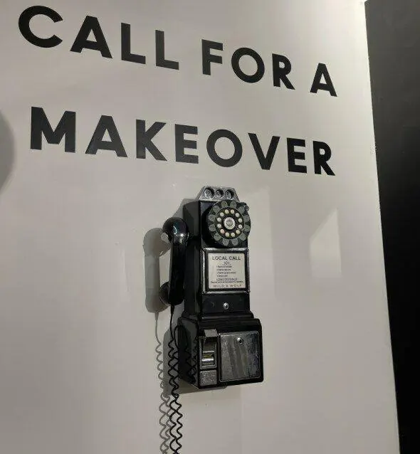 A wall phone under the words Call for a makeover.