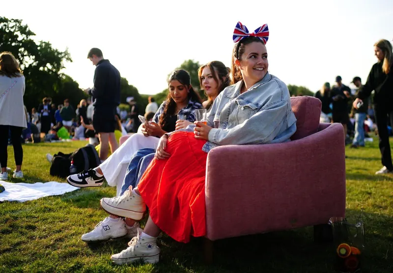 The Snug sofa in the queue, with the group sitting on it.
