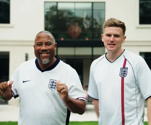 Will with John Barnes, both in England shirts.